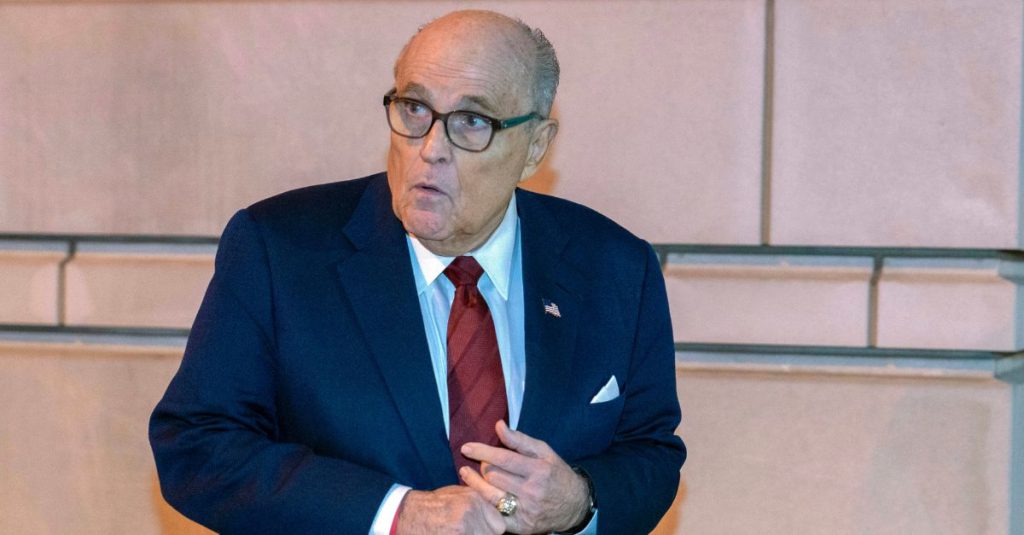 Former Mayor of New York Rudy Giuliani leaves the federal courthouse in Washington, Monday, Dec. 11, 2023. The trial will determine how much Rudy Giuliani will have to pay two Georgia election workers who he falsely accused of fraud while pushing President Donald Trump's baseless claims after he lost the 2020 election. (AP Photo/Jose Luis Magana)